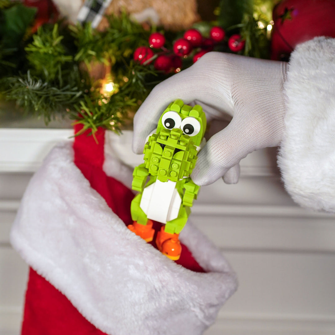 Mini Italian Dinosaur made of LEGO® bricks by Bricker Builds being put in a stocking