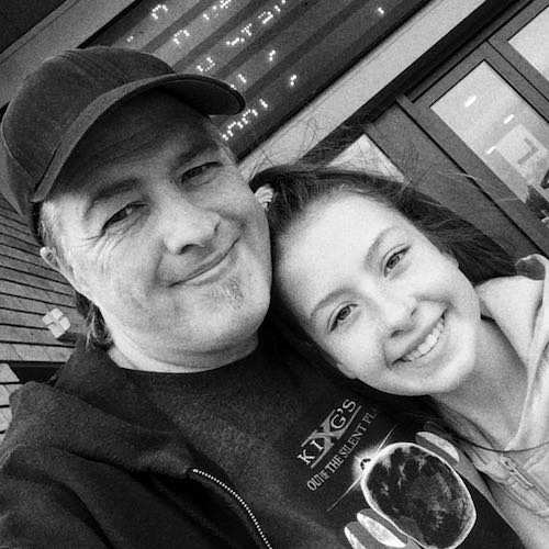 paul bowman wearing baseball cap standing next to female selfie profile photo